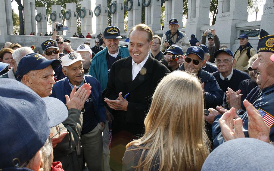 Former Sen. Bob Dole, R-Kan., meets with Honor Flight participants at the National World War II Memorial in Washington, D.C., in 2007.