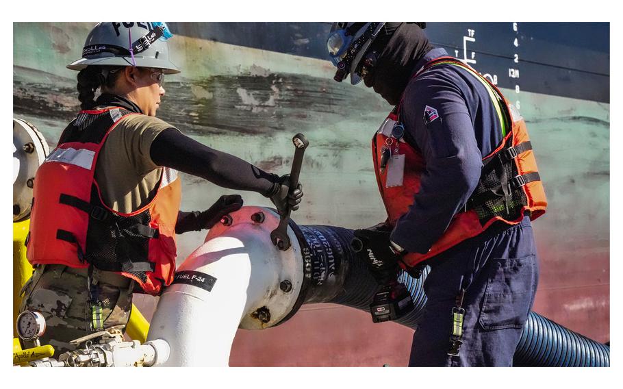 Personnel in support of Joint Task Force-Red Hill secure a fuel line to merchant tanker Empire State, initiating the fourth transfer of fuel from the Red Hill Bulk Fuel Storage on Oct. 30, 2023, at Joint Base Pearl Harbor-Hickam, Hawaii. 