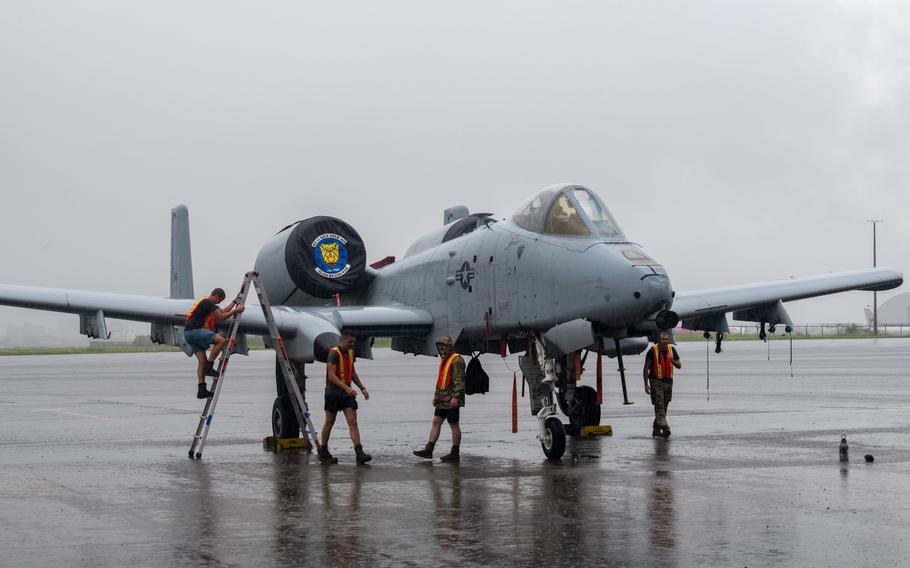 U.S. airmen complete post-flight procedures on an A-10C Thunderbolt II during exercise Cope Thunder at Clark Air Base in the Philippines on July 16, 2023. A-10s from the 354th Fighter Squadron are heading to the Middle East, U.S. Central Command said Oct. 12.