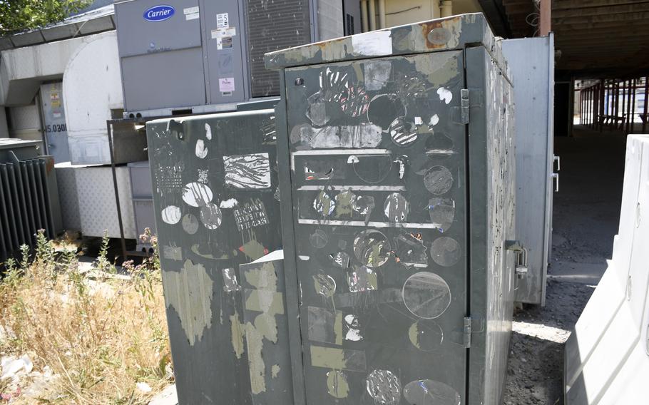 Troops, civilians and contractors pulled off stickers and any other images related to military units or America prior to the transfer of the base to Afghan security forces July 2, 2021.