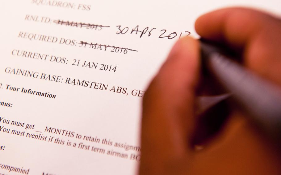 A personnel flight promotions specialist updates information on assignment paperwork at Ellsworth Air Force Base, S.D., in 2012. The new Enlisted Swap Assignment Program aims to allow airmen to share info about and mutually agree to exchange assignments. 