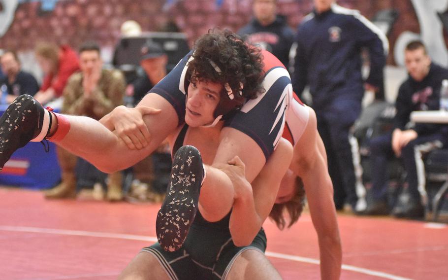 Naples' Kyson Fromm briefly has Aviano's Dylan Graney off his feet in a 157-pound match Saturday, Feb. 4, 2023, at the DODEA-Europe Southern Europe regional at Aviano Air Base, Italy.