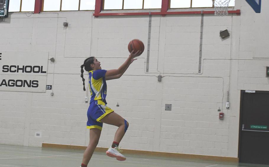 Sigonella's Ryleigh Denton drives for two points after stealing the ball against the Alconbury Dragons on Saturday. Denton scored 27 points over two games as the Jaguars defeated by Alconbury and Hohenfels.