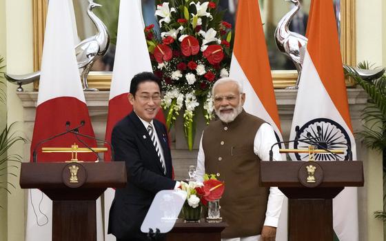 Japan’s Prime Minister Fumio Kishida, left and Indian Prime Minister Narendra Modi, shake hands after making press statements following their meeting in New Delhi, India, Monday, March 20, 2023.