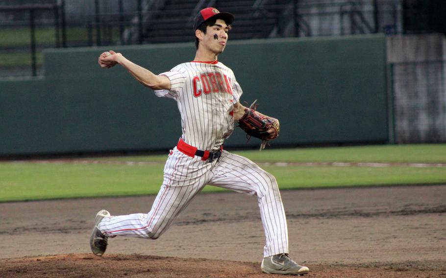 E.J. King's Nolan FitzGerald delivers against Matthew C. Perry during Friday's DODEA-Japan baseball game. The Samurai and Cobras split a twin bill, the Cobras winning 6-0 and the Samurai getting their first victory over King this season, 7-3.