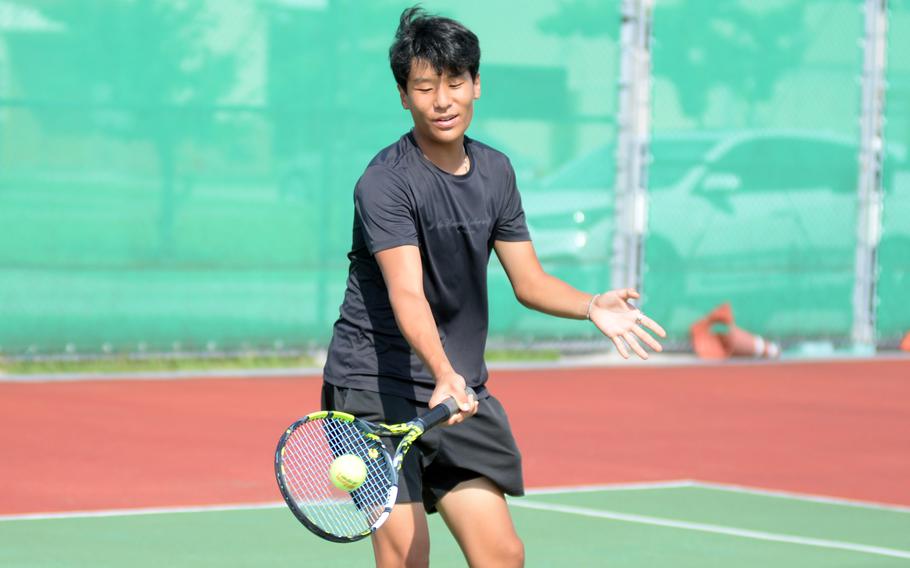 Nathan Hwang hits the ball.