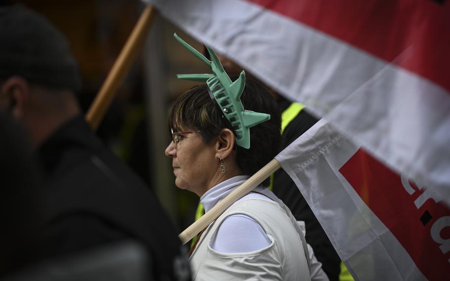 Ver.di union representative Susanne Riedel, wearing a Statue of Liberty-like crown, joins U.S. military employees and retail workers from IKEA and Primark during a workers protest in downtown Kaiserslautern, Germany, on Oct. 31, 2023, advocating for wage hikes.