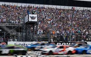 A race official waves the green flag signaling the start of the NASCAR Cup Series Autotrader EchoPark Automotive 400 race held at Dover Motor Speedway, July 20, 2025. Team Dover members participated in pre-race festivities which included presenting of the Colors by the Dover Air Force Base Honor Guard, the singing of the national anthem and a fly-over by a C-5M Super Galaxy. (U.S. Air Force photo by Airman 1st Class Liberty Matthews)