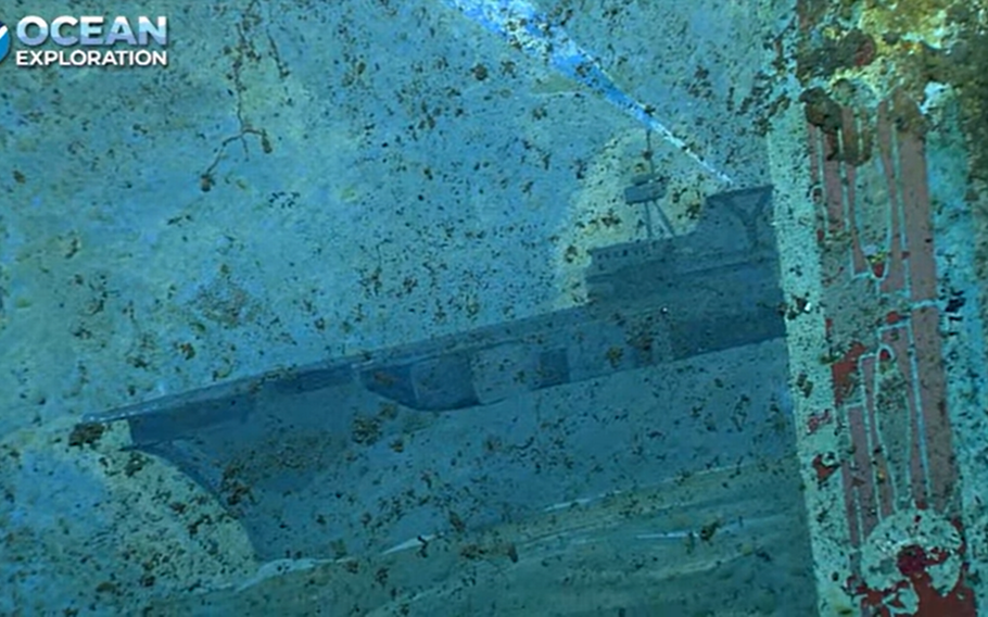 This video screengrab shows part of a mural on the sunken USS Yorktown that depicts the ship in the bottom of the right-hand corner.
