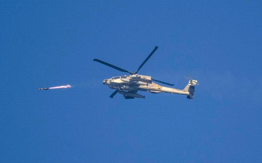 Israeli attack helicopter fires a missile into the Gaza Strip on Dec. 18.