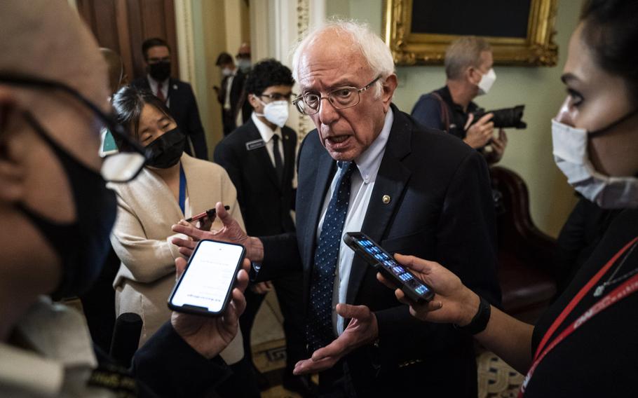 Sen. Bernie Sanders, I-Vt., speaks with reporters after departing a Democrat luncheon on Capitol Hill on Thursday in Washington.