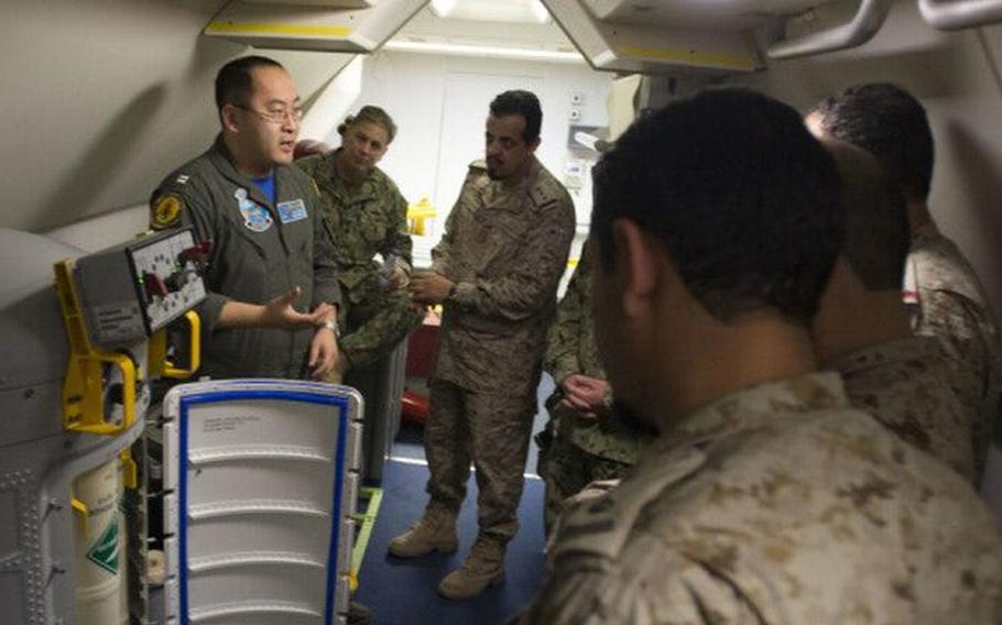 U.S. Navy Lt. Fan Yang, left in this 2018 photo, is scheduled to stand trial next month on charges rooted in a federal investigation of Chinese business executive Ge Songtao.