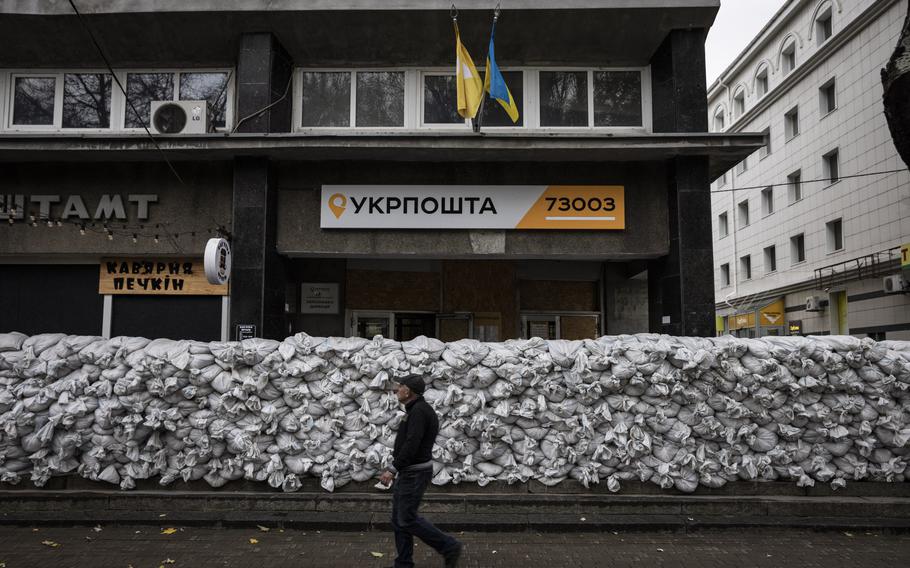Sandbags stacked in front of a postal-service building in Kherson, Ukraine.