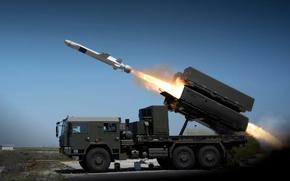 A missile is fired from a land-based system.