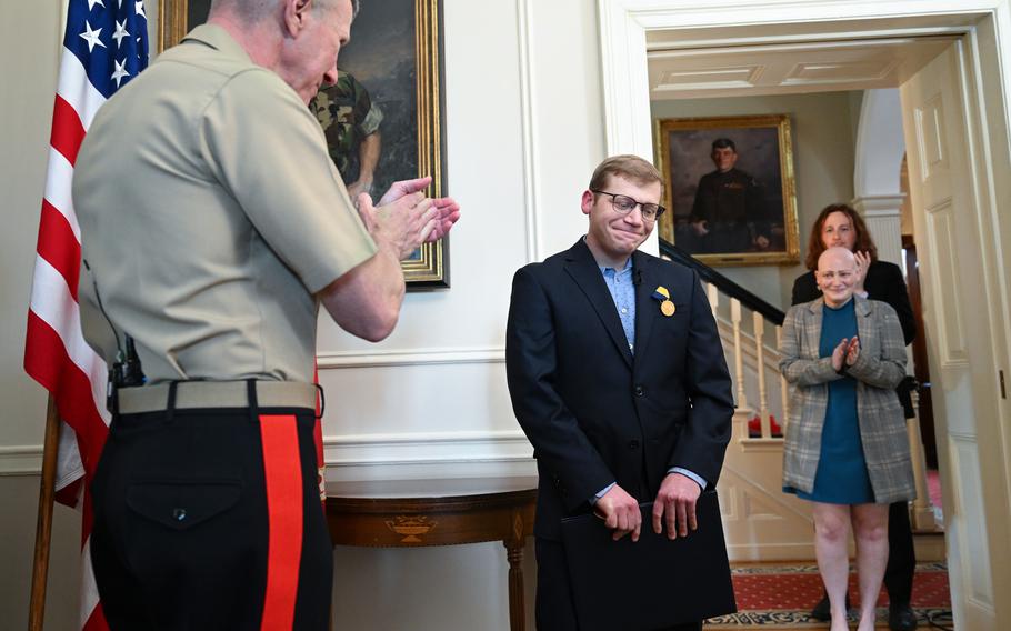 Gen. Eric M. Smith, left, applauds Timothy LaLonde.