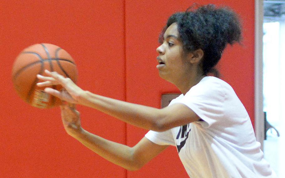 Senior Dana White is the one tall player on a Kinnick girls basketball roster loaded with guards.