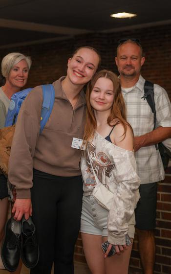 People pose for photos.