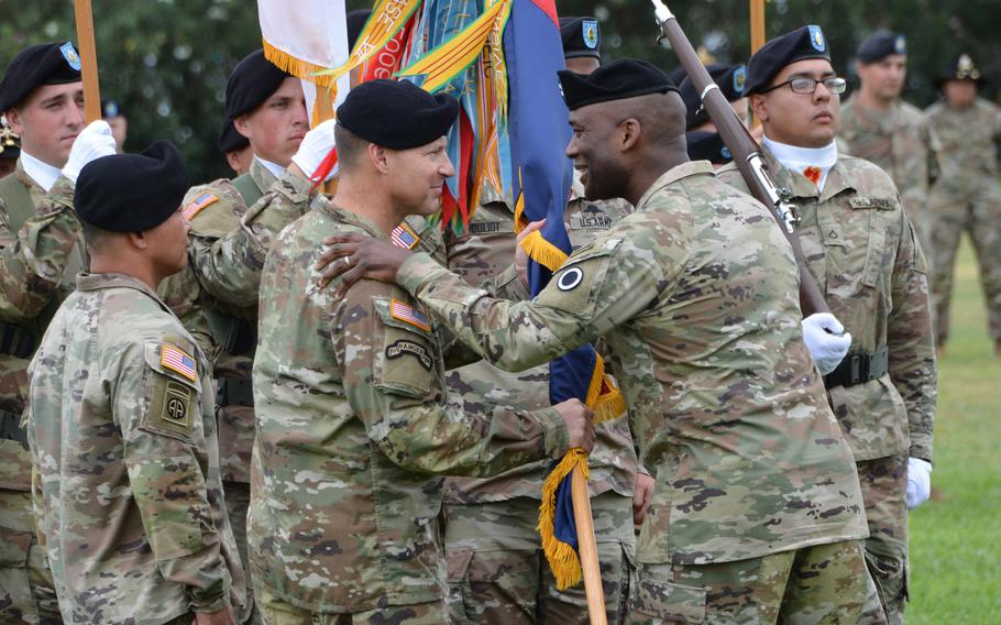 I Corps Commander Maj. Gen. Xavier Brunson, right, congratulates Brig. Gen. Joseph Ryan for taking command of the 25th Infantry Division during a ceremony at Schofield Barracks, Hawaii, Friday, July 23, 2021.