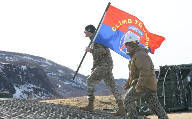 BJERKVIK, Norway (April 26, 2024) - U.S. Army Col. Ryan Barnett, commander, 3rd Brigade Combat Team, 10th Mountain Division, left, and U.S. Navy Lt. Mason Mullins, assigned to Naval Mobile Construction Battalion (NMCB) 11, cross a medium girder bridge laid down in support of Immediate Response 2024 in Bjerkvik, Nordland County, Norway, April 26, 2024. DEFENDER is the Dynamic Employment of Forces to Europe for NATO Deterrence and Enhanced Readiness, and is a U.S. European Command scheduled, U.S. Army Europe and Africa conducted exercise that consists of Saber Strike, Immediate Response, and Swift Response. DEFENDER 24 is linked to NATO’s Steadfast Defender exercise, and DoD’s Large Scale Global Exercise, taking place from 28 March to 31 May. DEFENDER 24 is the largest U.S. Army exercise in Europe and includes more than 17,000 U.S. and 23,000 multinational service members from more than 20 Allied and partner nations, including Croatia, Czechia, Denmark, Estonia, Finland, France, Germany, Georgia, Hungary, Italy, Latvia, Lithuania, Moldova, Netherlands, North Macedonia, Norway, Poland, Romania, Slovakia, Spain, Sweden, and the United Kingdom. (U.S. Navy photo by Mass Communication Specialist 2nd Class James S. Hong)