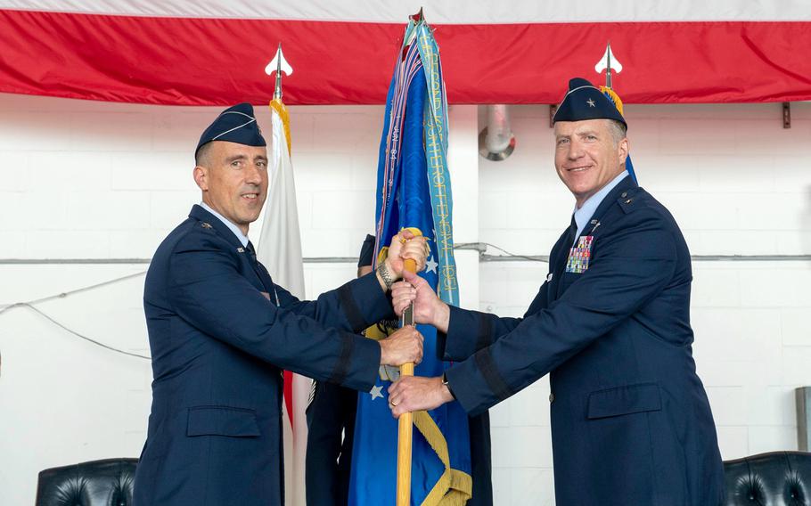 Brig. Gen. David Eaglin, right, accepts command of the 18th Wing from 5th Air Force deputy commander Maj. Gen. Leonard Kosinski at Kadena Air Base, Okinawa, Friday, July 16, 2021.