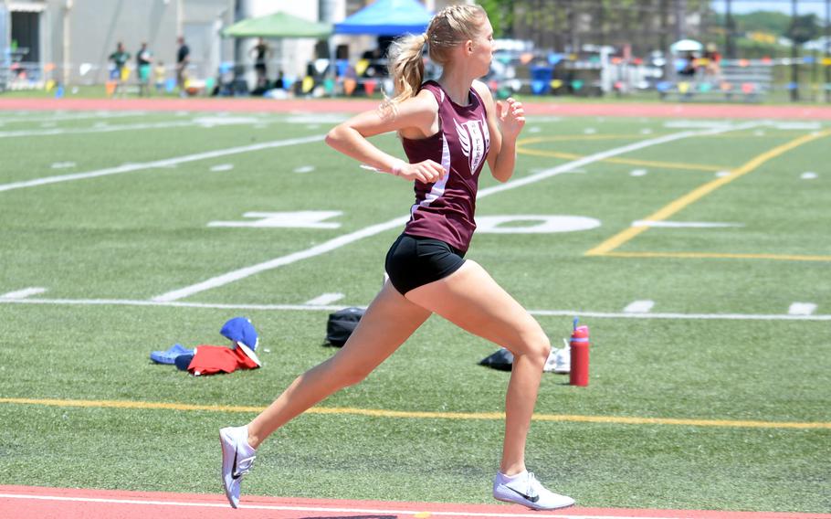 Eyeing the display timer to her left, Matthew C. Perry senior Jane Williams completes the first lap en route to a meet and Pacific record in the 800.