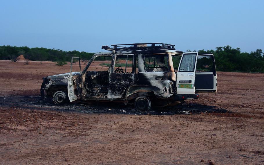 The wreckage of a car in which six French aid workers, their local guide and a driver were killed by unidentified gunmen riding motorcycles is seen in an area of southwestern Niger on Aug. 9, 2020.