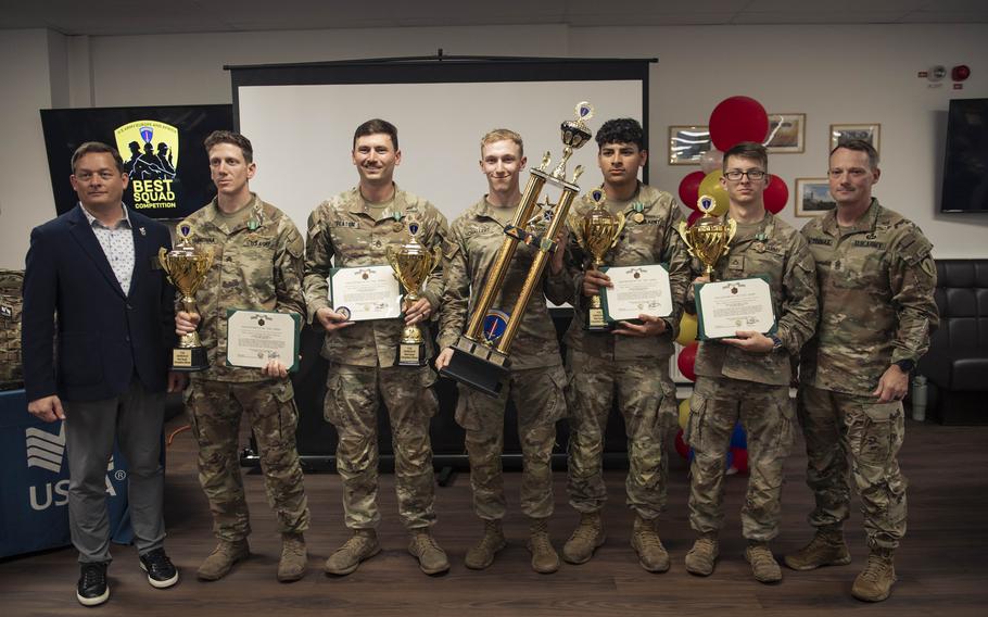 The winning team, with their certificates.