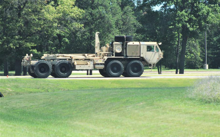 Soldiers operate an M1120 Load Handling System on the cantonment area during installation training operations July 24, 2018, at Fort McCoy, Wis. The truck is an eight-wheel drive, diesel-powered, tactical truck used by the U.S. military and others. In the Army, the M1120 can be equipped with several different styles of flat racks for the load handling system.