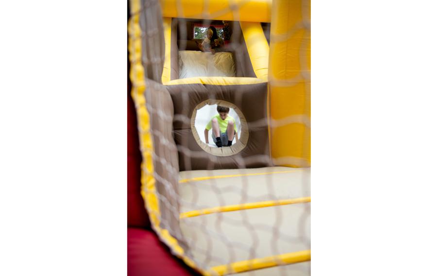 Joseph Clarke, from Poulsbo, Wash., plays in a bounce house during the Exceptional Family Member Program’s family picnic at Camp McKean in Bremerton, Wash., in August 2015. 