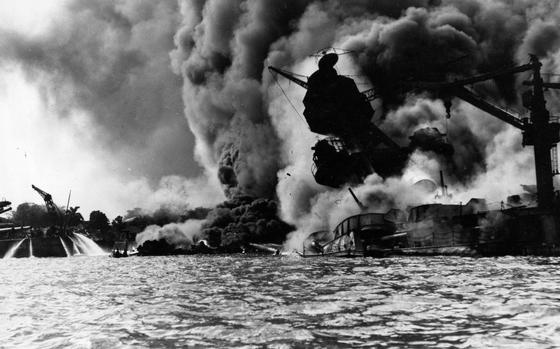 The USS Arizona burns after being struck by Japanese bombs during the attack on Pearl Harbor, Hawaii, on Dec. 7, 1941.
