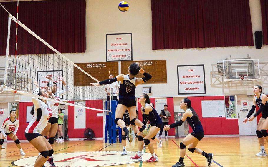 Seisen's Ann Katashiba goes up to attack against Nile C. Kinnick during Tuesday's Kanto Plain volleyball match. The Phoenix won in five sets.