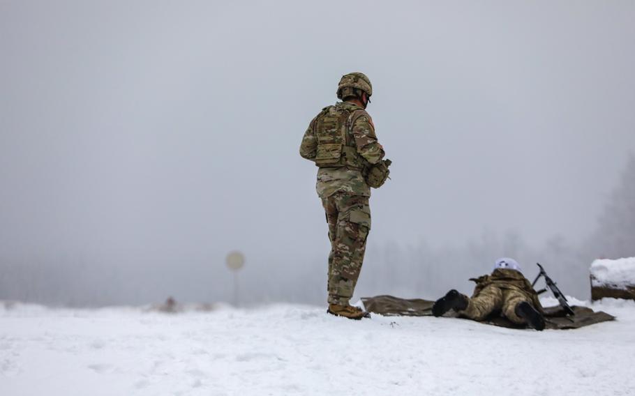 Ukraine’s Task Force Gator Senior Enlisted Leader, Command Sgt. Maj. Jasen Pask, watches as a first year NCO Academy cadet participates in rifle training at the International Peacekeeping and Security Center, in Yavoriv, Ukraine, on Dec. 15, 2021. The Pentagon announced on Saturday, Feb. 11, that National Guard troops on a training mission in Ukraine have been pulled out of the country.