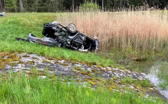The totaled Volkswagen Jetta of a 23-year-old U.S. service member who was seriously injured in a car accident May 15, 2021, on the A9 autobahn near Bayreuth, Germany, lies on its roof near a drainage ditch.

Pegnitz Fire Department