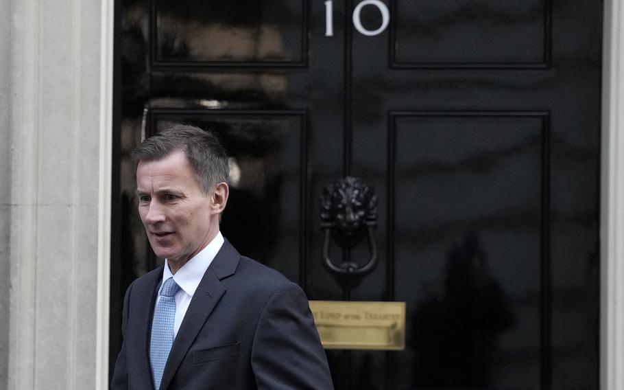 Britain’s Chancellor of the Exchequer Jeremy Hunt leaves 10 Downing Street in London, Jan. 18, 2023. Britain’s Treasury chief said he would be prepared to see the U.K. economy slip back into recession if further interest rate hikes are necessary to bring down inflation. 