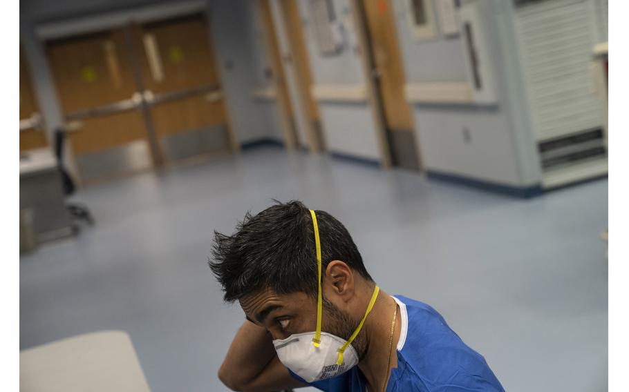 Kanak Patel, director of critical care at Doctors Community Hospital, looks through patient records Jan. 14, 2022. 