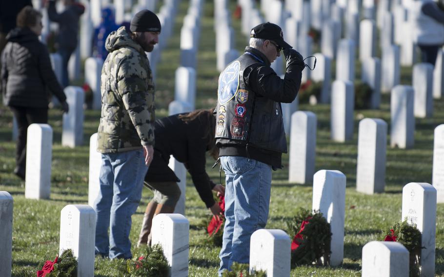 Mike Forristel of Mayville, N.J., a veteran who served during the Vietnam era  salutes after placing a wreath. at Arlington National Cemetery on Saturday, Dec. 17, 2022.