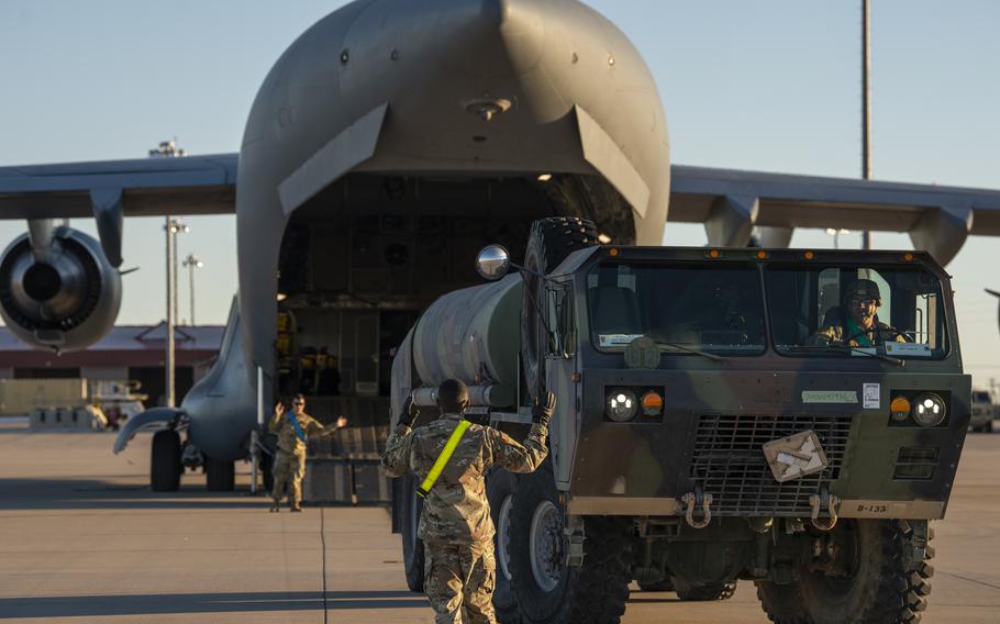 Soldiers and airmen prepare to load elements of a THAAD missile system onto a C-17 Globemaster III at Fort Bliss, Texas, in February 2019. 