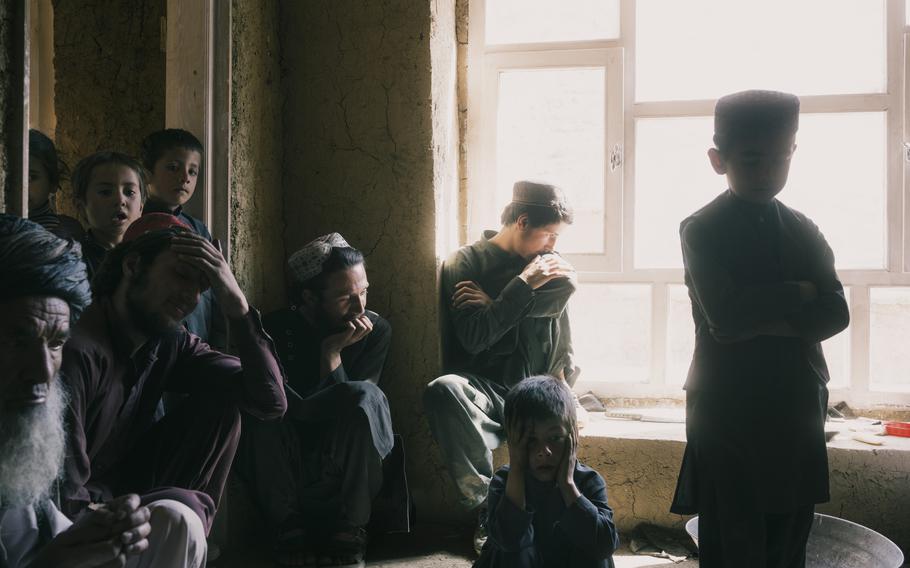 The family of Sher Mohammed, far left, was inside their home in the village of Sarmarda in April 2019 when Afghan forces raided the compound. When his son refused to come out, Mohammed said, an airstrike was called on the house. His son, his son’s wife, their three children and two other relatives were killed. 