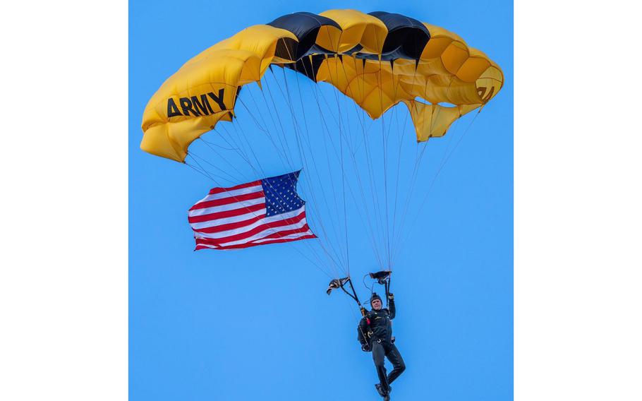 A member of the U.S. Army Golden Knights parachute team descends during a November 2021 event in Plymouth, Mass. On Saturday, Jan. 1, 2022, four Golden Knights parachuters dropped from a plane for the Rose Parade in Pasadena, Calif.