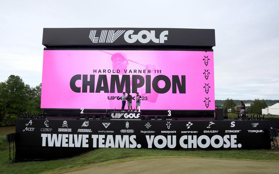 Harold Varner III of RangeGoats GC poses with the trophy after winning the LIV Golf Invitational-DC at Trump National Golf Club on May 28, 2023, in Sterling, Va.