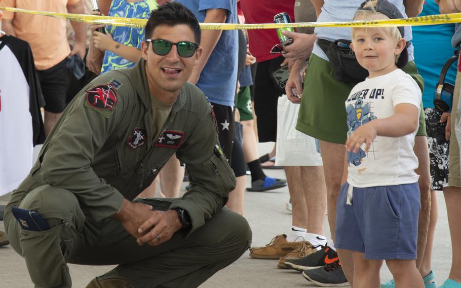 Capt. Shane Bilek of the 107th Fighter Squadron, Selfridge Air National Guard Base, Mich. (SANGB), answers questions for a child during the Selfridge Open House and Air Show on July 10, 2022.