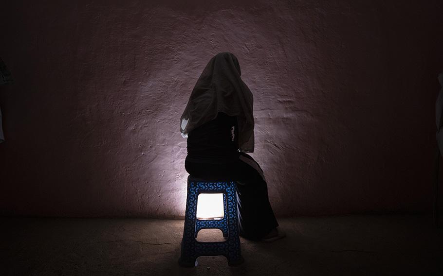 A Tigrayan refugee rape victim who fled the conflict in Ethiopia’s Tigray sits for a portrait in eastern Sudan near the Sudan-Ethiopia border, March 20, 2021. 