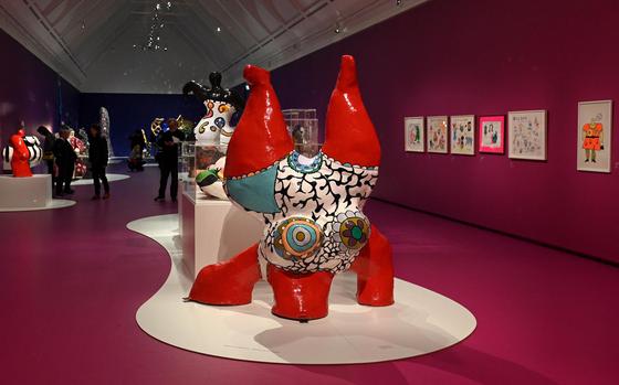 The Niki de Saint Phalle exhibit at the Schirn in Frankfurt, Germany, with one of the artist’s famous Nanas, Red Nana Legs in the Air," in the foreground. The exhibit runs through May 21, 2023.