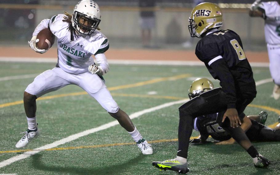 Kubasaki's Carlos Cadet tries to swerve around Humphreys' Naevon Tucker.