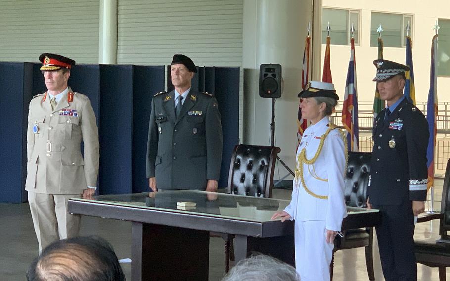 United Nations Command leaders pose beside a section of a table used during the signing of the Korean War armistice agreement, Wednesday, July 27, 2022, at the War Memorial of Korea in Seoul. From left, British army Lt. Gen. Andrew Harrison, U.N. Command’s deputy commander; Swiss Gen. Ivo Burgener, of the Neutral Nations Supervisory Commission; Capt. Jill Marrack, the Canadian chief liaison to U.N. Command; and South Korean Gen. Nam Wan-su, of U.N. Command’s Military Armistice Commission.