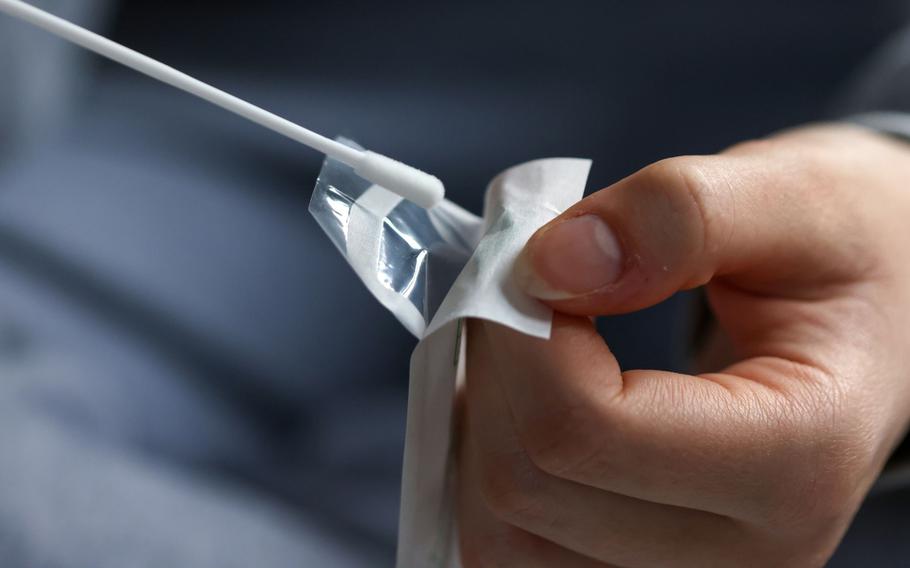 A cotton swab from a COVID-19 lateral flow self-test kit, arranged in Danbury, U.K., on Dec. 29, 2021.