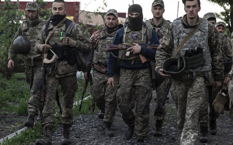 Members of a Ukraine battalion of young soldiers as they return to their base near Kramatorsk, Ukraine, on May 28, 2022. They have spent their days digging defensive trenches in a pocket not far from the front line to provide additional support for soldiers battling the Russians head-on. 