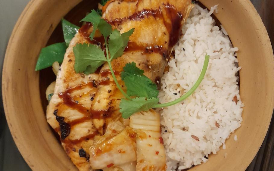 The fish pot at Tokygon in Wiesbaden, Germany, consists of salmon served in a garlicky soy bouillon atop jasmine rice.