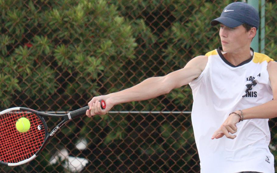 Kadena's Evan Davis hits a forehand return against Kubasaki's Owen Ruksc during Wednesday's Okinawa tennis matches. Davis won 9-8 (7-3).