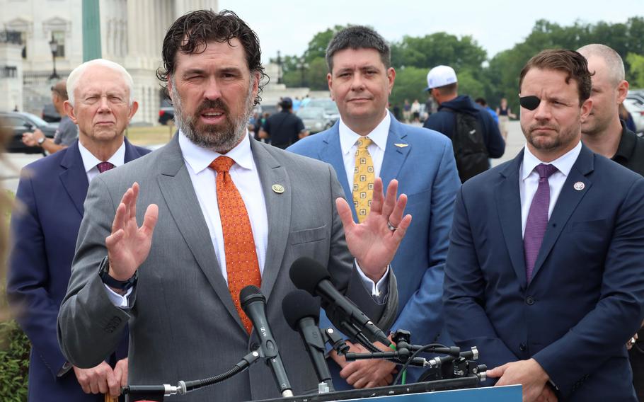 Rep. Morgan Luttrell, R-Texas, speaks at a Capitol Hill news conference on the Douglas “Mike” Day Psychedelic Therapy to Save Lives Act, Wednesday, June 14, 2023. Behind him are Rep. Jack Bergman, R-Mich., Jonathan Lubecky and Rep. Dan Crenshaw, R-Texas.